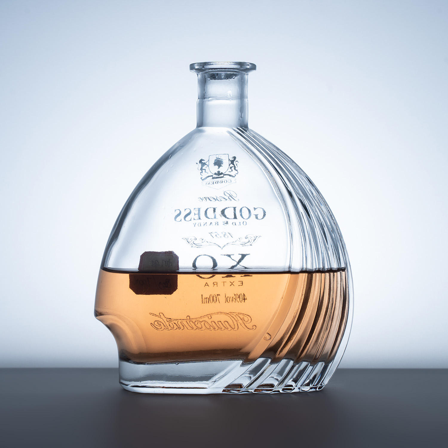 Photograph of an empty custom glass liquor bottle from BC Glass